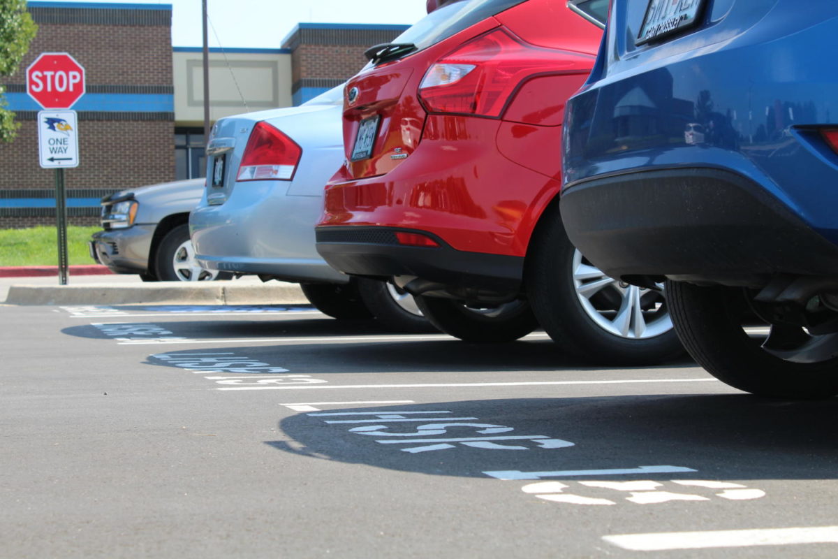 Students make the switch to new open parking rules for the new school year. Photo by Morgan Clark.