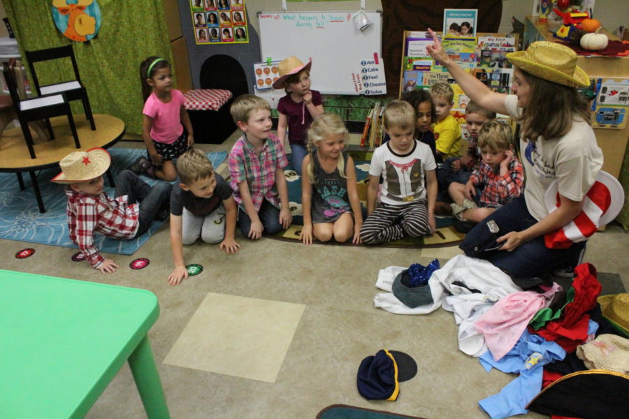 Students at the Early Bird Learning Center try on costumes and get ready for Safe Halloween, which took place on October 24 in the LHS cafeteria. Photo by Katelynn Dale.