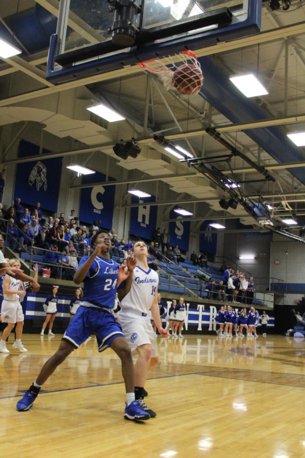 Senior Tavis Turner attempts to box out his opponent in order to get a rebound in a game at St. Joe Central on January 25, where the Jays won 55-36. Photo by Chrystian Noble.