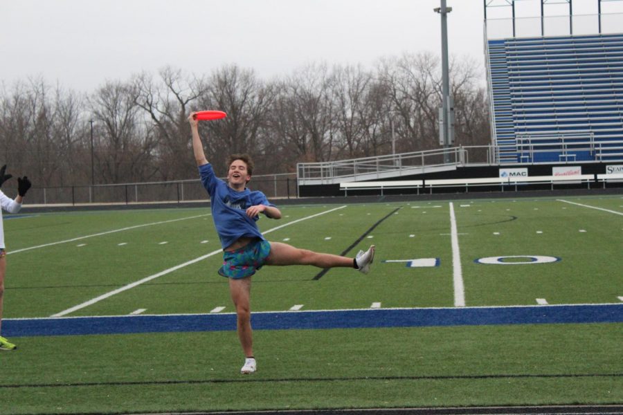 Sophomore Reagan Manis catches a frisbee while participating in a game of ultimate frisbee during an FCA meeting. “It’s a really easy game to understand and to play that requires hardly any equipment at all,” senior Peter Mallon said. “The game has gotten so popular among the members of FCA,. Photo by Alyssa Griffith.