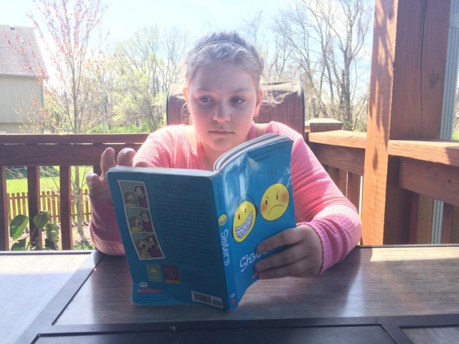 My sister enjoys reading and does this to pass time.
Photo by Hannah Mayfield

