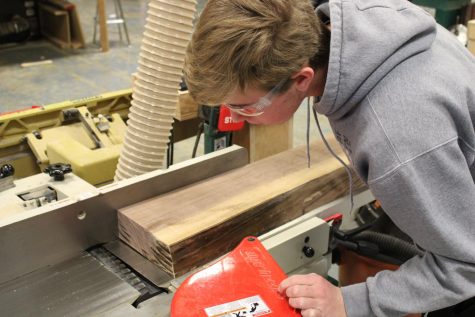 In March 2022, senior Hayden Bracken (pictured) and LHS alum Trevor White created a table made from the remains of a tree which had long stood outside of Franklin Elementary School.
“I thought the table was a great way to utilize the lumber. I requested him to make something big, rather than cut the wood up into a bunch of smaller pieces, and it turned out great,” teacher Josh Jacobs said.