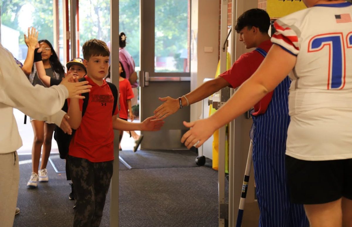 Fall sports, Spirit Leaders, and Blue Crew Crazies visited the elementary schools in the district during the morning of Sep. 18. “I enjoyed being a role model to the little kids during our visit,” Brooke Roseberry said. Photo courtesy of Tricia Middleton.
