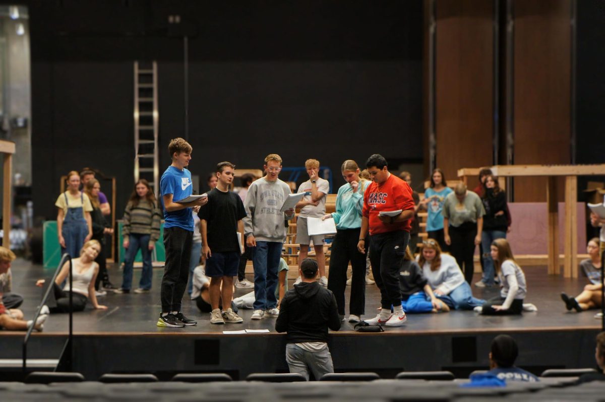 Senior Parker Blaine, Freshman Maclin Cooper, Sophomore Bennett Dohrmann, Junior Madelynn Heits and Senior Abel Enriquez talk to Choreographer Brian Duncan. The cast rehearses blocking after Hannibal, which is the first of three operas in the musical.  “It’s the opening scene, it's where the main characters are first introduced to the audience members and where we start to see conflict arise in the show,” Heits said. 