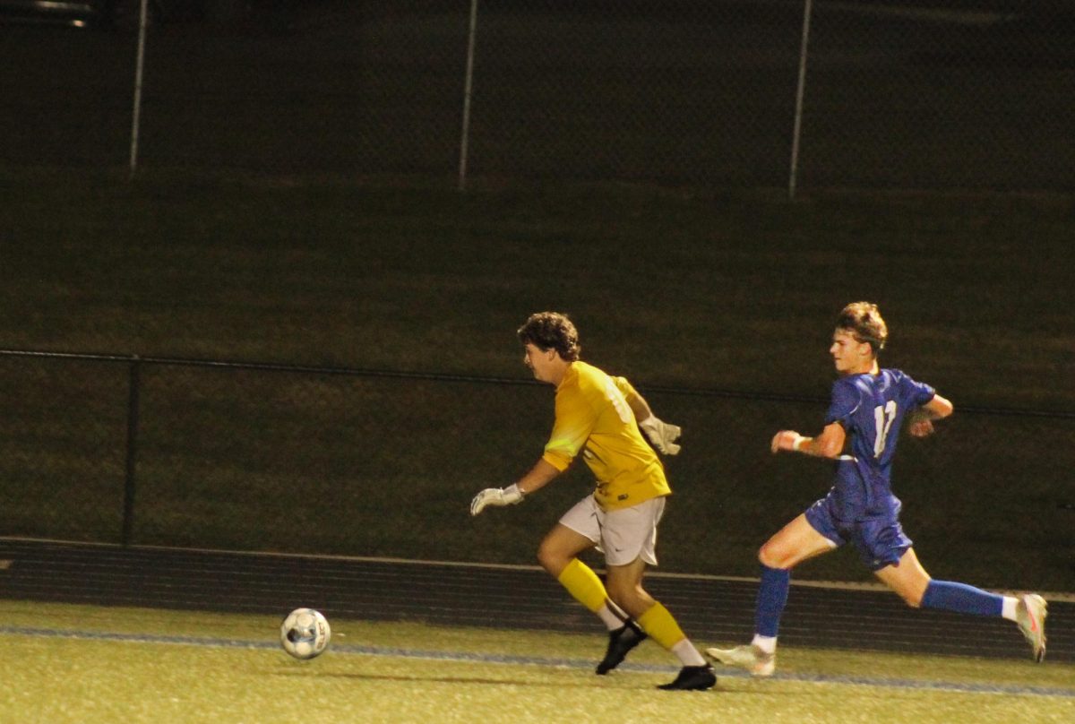 Sophomore Hudson Sutton makes his way to the ball on Oct. 14. playing against Park Hill High School. They worked hard and made their way to win 5-2. “Soccer impacts my life by being faster and more in shape and helps with making more friends,” Sutton said.