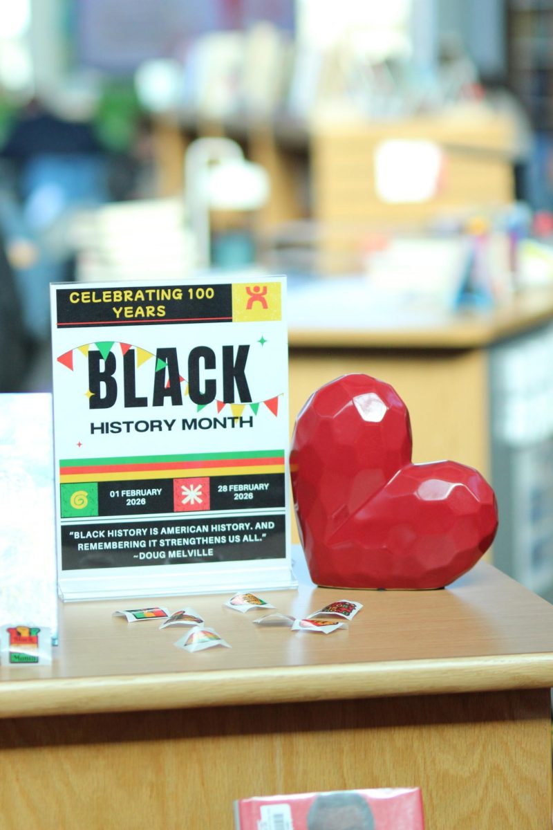 On Feb. 1. the Library Media Center (LMC) highlights Black History month as part of their mission is to support and provide inclusive learning to all students. They are offering coloring pages featuring quotes from influential African Americans. When students or staff members turn in a completed sheet, it is displayed on the main wood wall in the LMC to create a community-driven activity that also serves as a visual celebration of Black History Month alongside their other programs. “It is important that all LHS students see themselves reflected in the stories within the LMC while also having the opportunity to experience paths different from their own,” Library Media Specialist Dr. Brooke Fuendling said. Photo by Ceily Tiemann. 