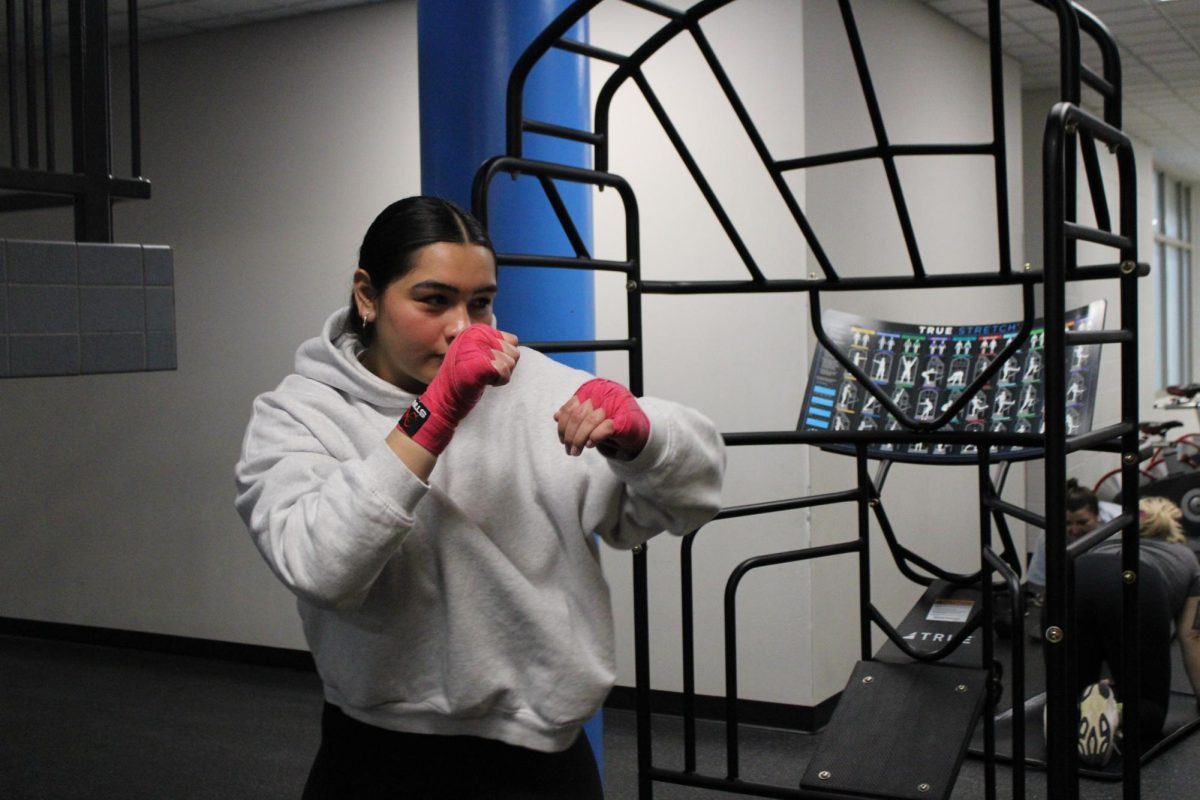 Sophomore Marisol Flores expresses herself about how boxing impacts her life. She shared that she gained so many exciting experiences with boxing. “How I've met a lot of people that have been good mentors to me, and how I've had opportunities that I wouldn't have had without boxing,” Flores said. Photo by Iyari Hyde.