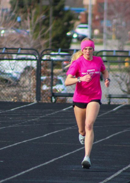 Freshman Tessa Perdue is at the beginning of her high
school track career. She ran track and cross-country in
seventh and eighth grade, demonstrating her next-level
athleticism by putting her best foot forward for every race.
”My mom and my dad are really my biggest supporters
there,” Perdue said. Photo by Lorelai Hupp.