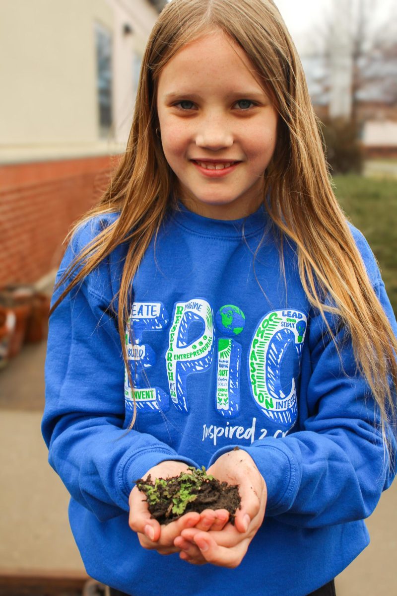 Fifth Grader Danielle at
Epic Elementary helps
maintain the 5th-grade
garden outside the school.
Danielle’s class takes
turns taking care of the
class garden to ensure the
plants are growing well. “I
love helping plants grow,”
Danielle said. Photo by
Gracee Peugh.